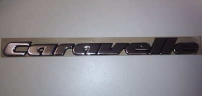 Emblēma CARAVELLE VW T4 91-04 OE VAG 705853689GZ10
